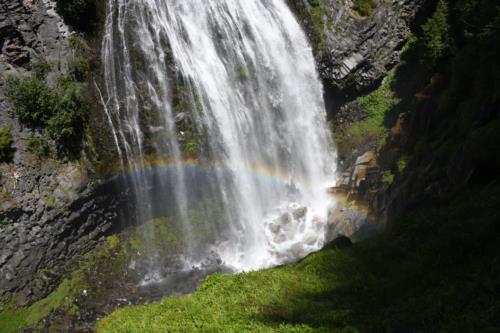 A rainbow appearing below Narada Falls, in mount Rainier